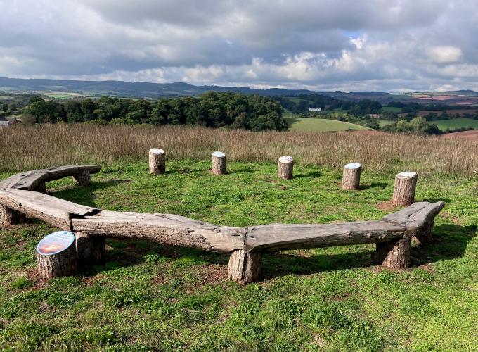 Circular wooden bench at the top of Ridgetop Park